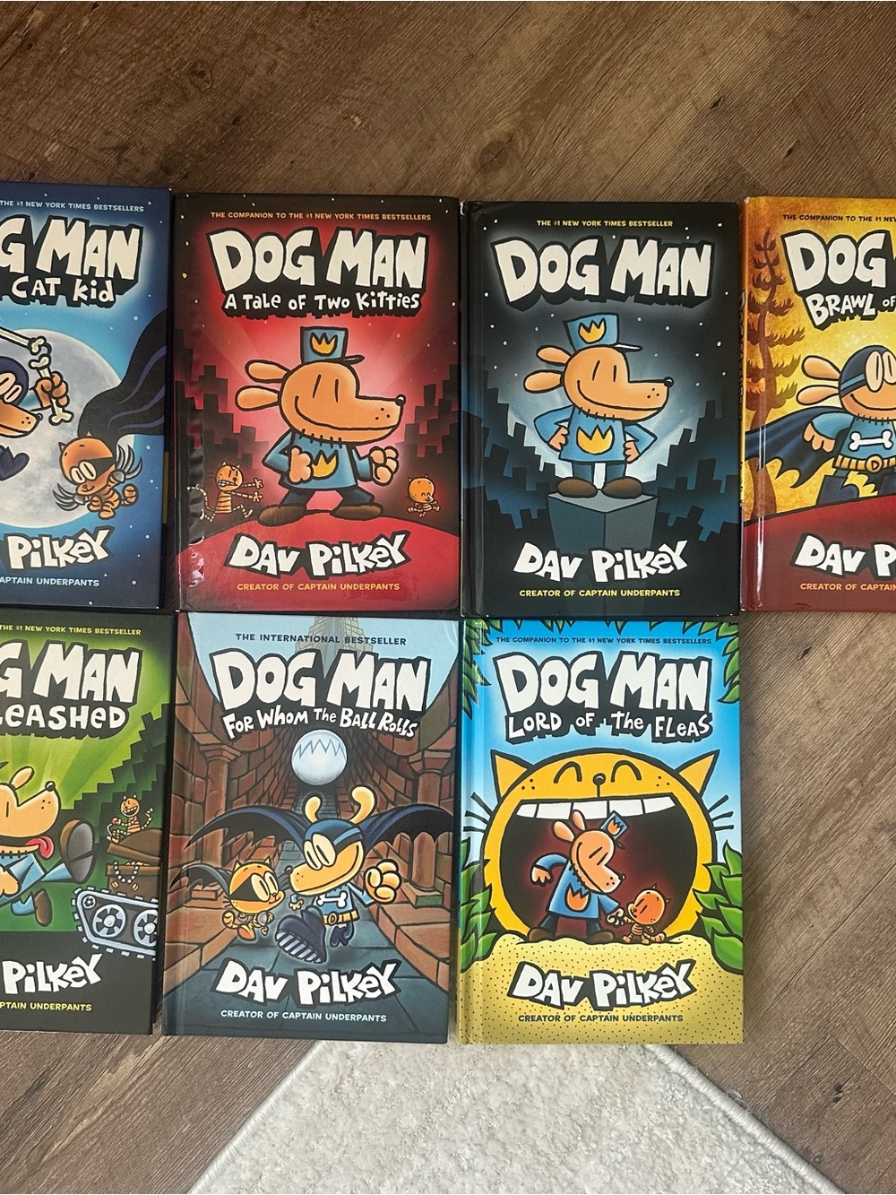 Dog Man Graphic Novel Collection by - Blue, Red, Black, Yellow Covers